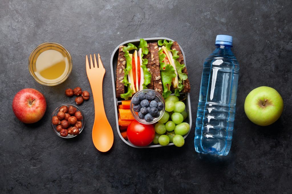 Healthy school lunch box with sandwich and fresh vegetables